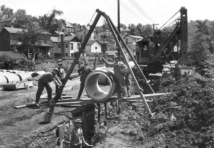 Historic photo from 1926 of crews installing a sewer main