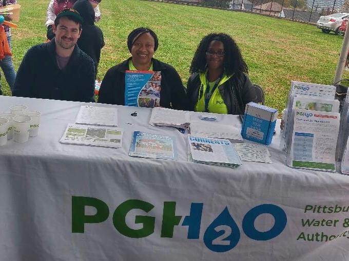 From left: Public Affairs Associate Nick Letzkus and Lead Program Customer Assistance Representatives Bianca Alton and Tasha Butler at Brightwood’s annual Halloween Parade and Pumpkinfest on October 26.