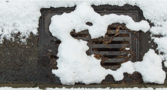 A snow covered storm drain