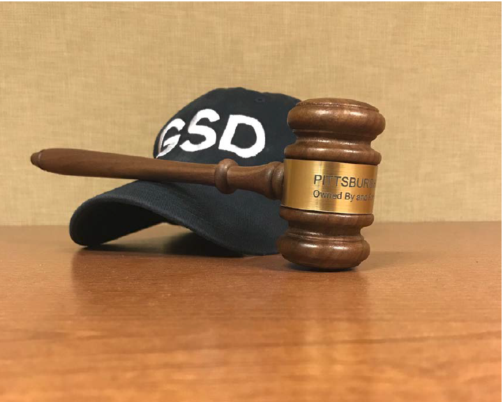 A Get Stuff Done hat along with a PWSA Board of Directors gavel