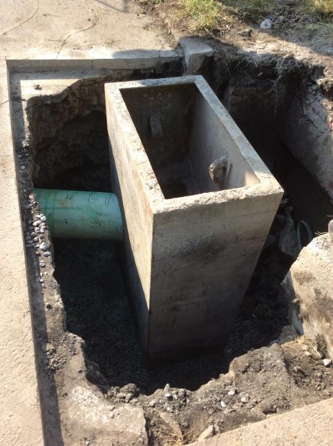 New underground components of a storm drain in a street.