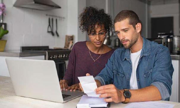 A couple reviewing a utility bill