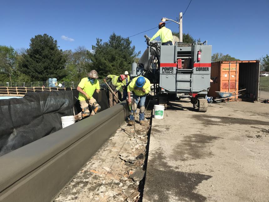 A crew working on the Highland I Reservoir Security Improvements Project