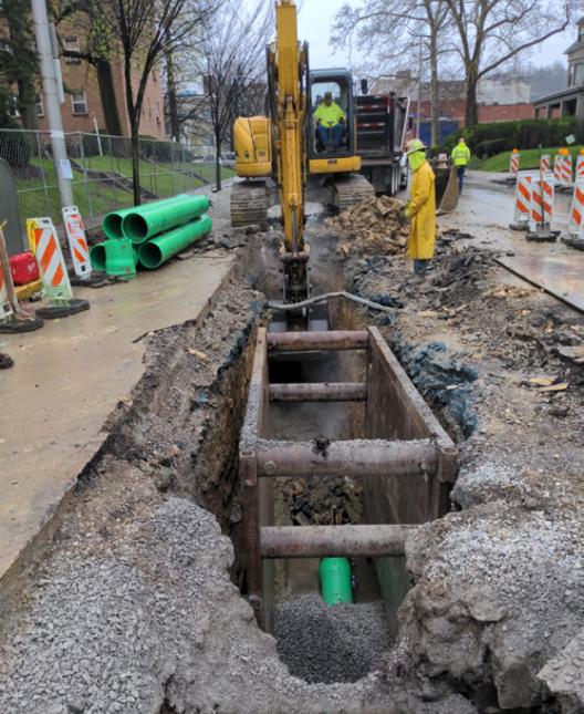 Crews prepare trench for sewer replacement on Centre Avenue