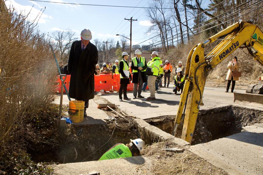 Deputy Assistant Administration for the EPA’s Office of Water Bruno Piggot watches as crews replace lead service line on Hazelwood Avenue