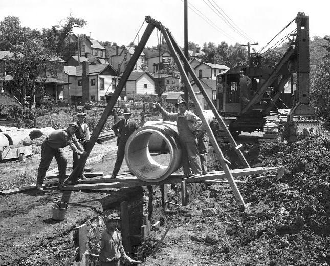 Historic photo from 1926 of crews installing a sewer main