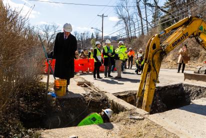 Principal Deputy Assistant Administrator for the EPA’s Office of Water Bruno Pigott watches as crews replace lead service lines on Hazelwood Avenue.