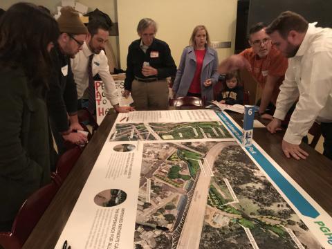 Community members discuss preliminary plans for Four Mile Run at a community meeting.