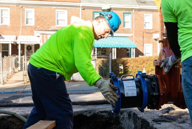 A PWSA Operation crew installs a new valve on a water main.